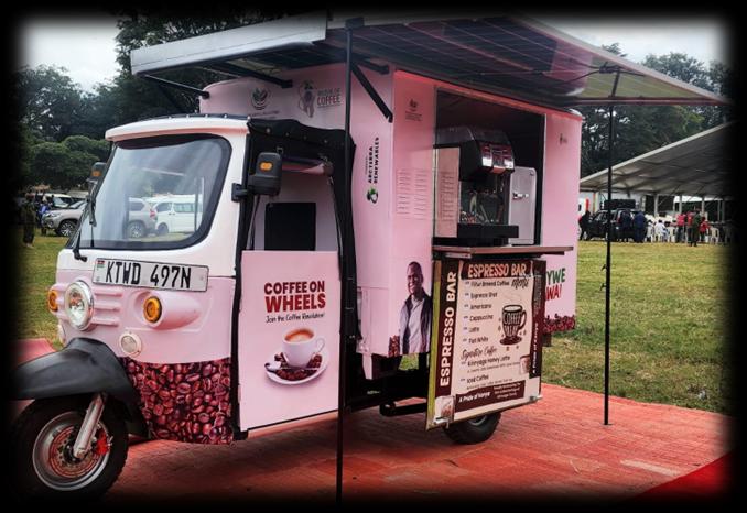 Front view of the pink Coffee on Wheels solar-powered espresso bar